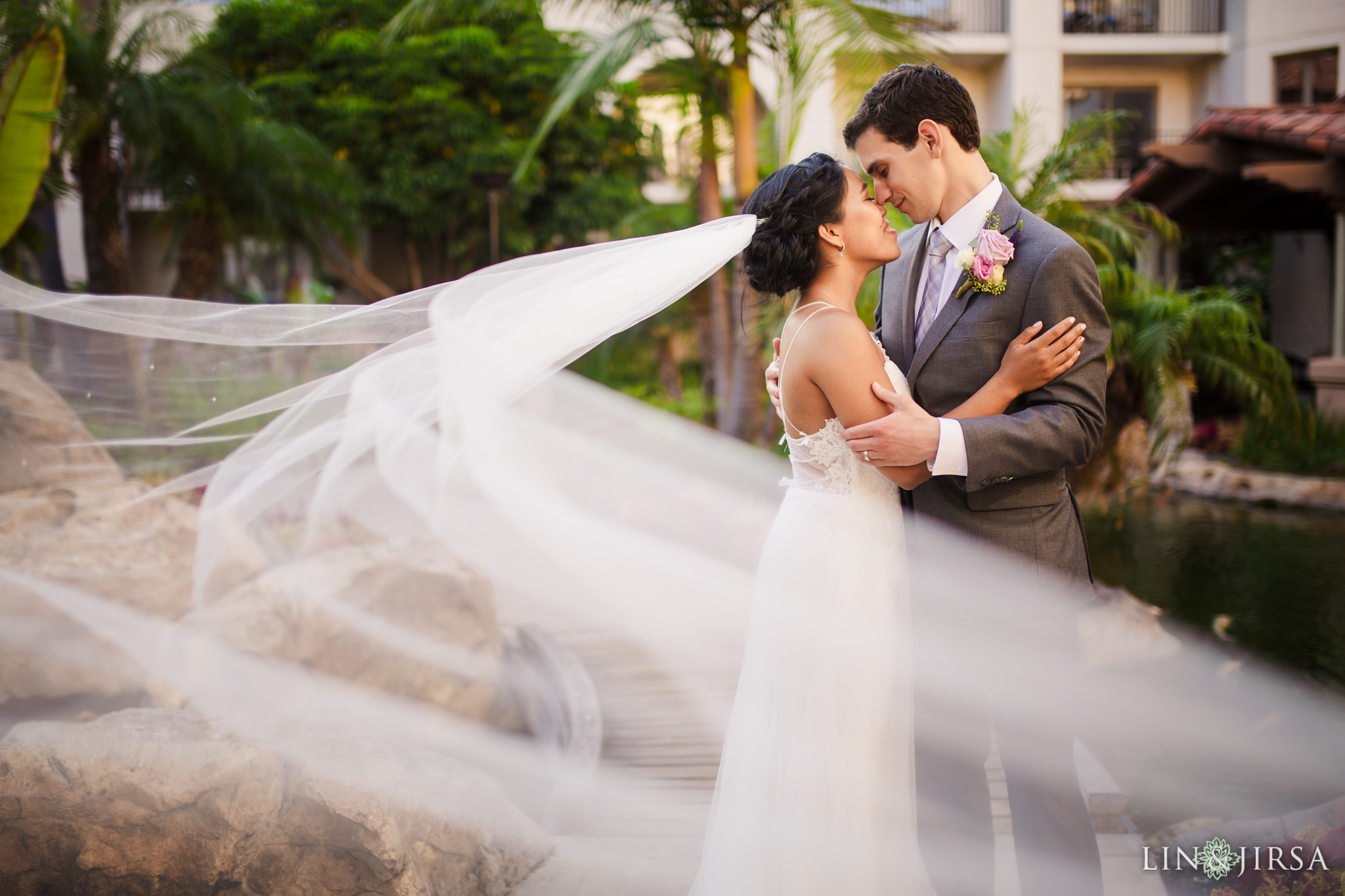 Couple session in the garden near Pacific Waters Spa at a Hyatt Regency Huntington Beach wedding by Lin and Jirsa