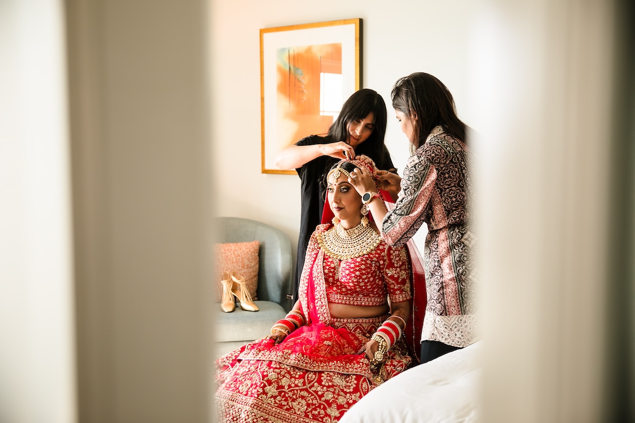 Bride getting ready in suite at Ritz-Carlton Marina del Rey wedding photography by Lin and Jirsa