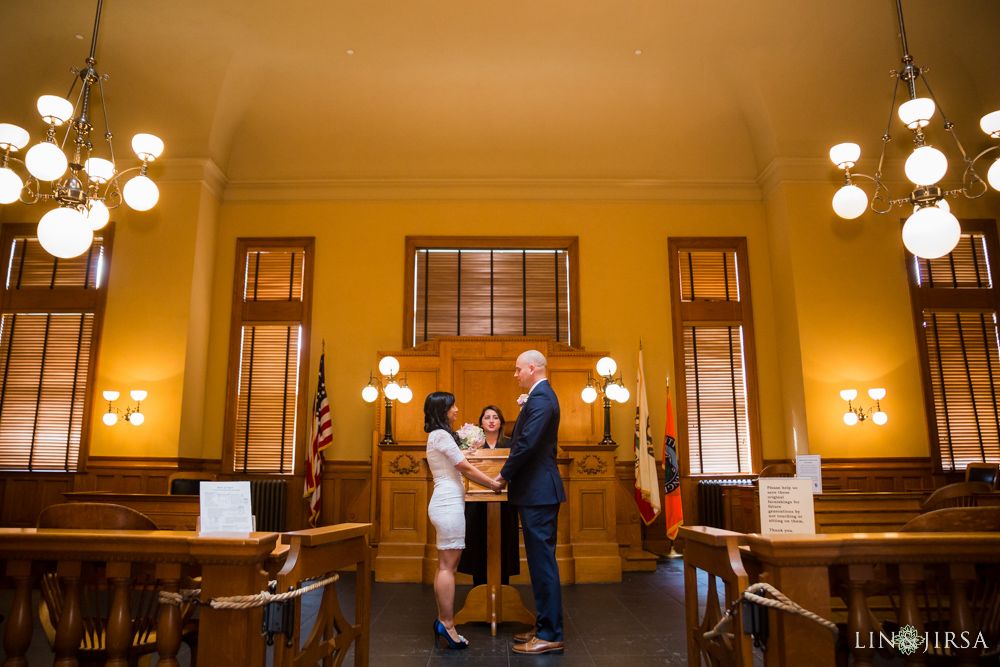 Bride and groom holding hands during civil ceremony at Old Courthouse Museum Santa Ana