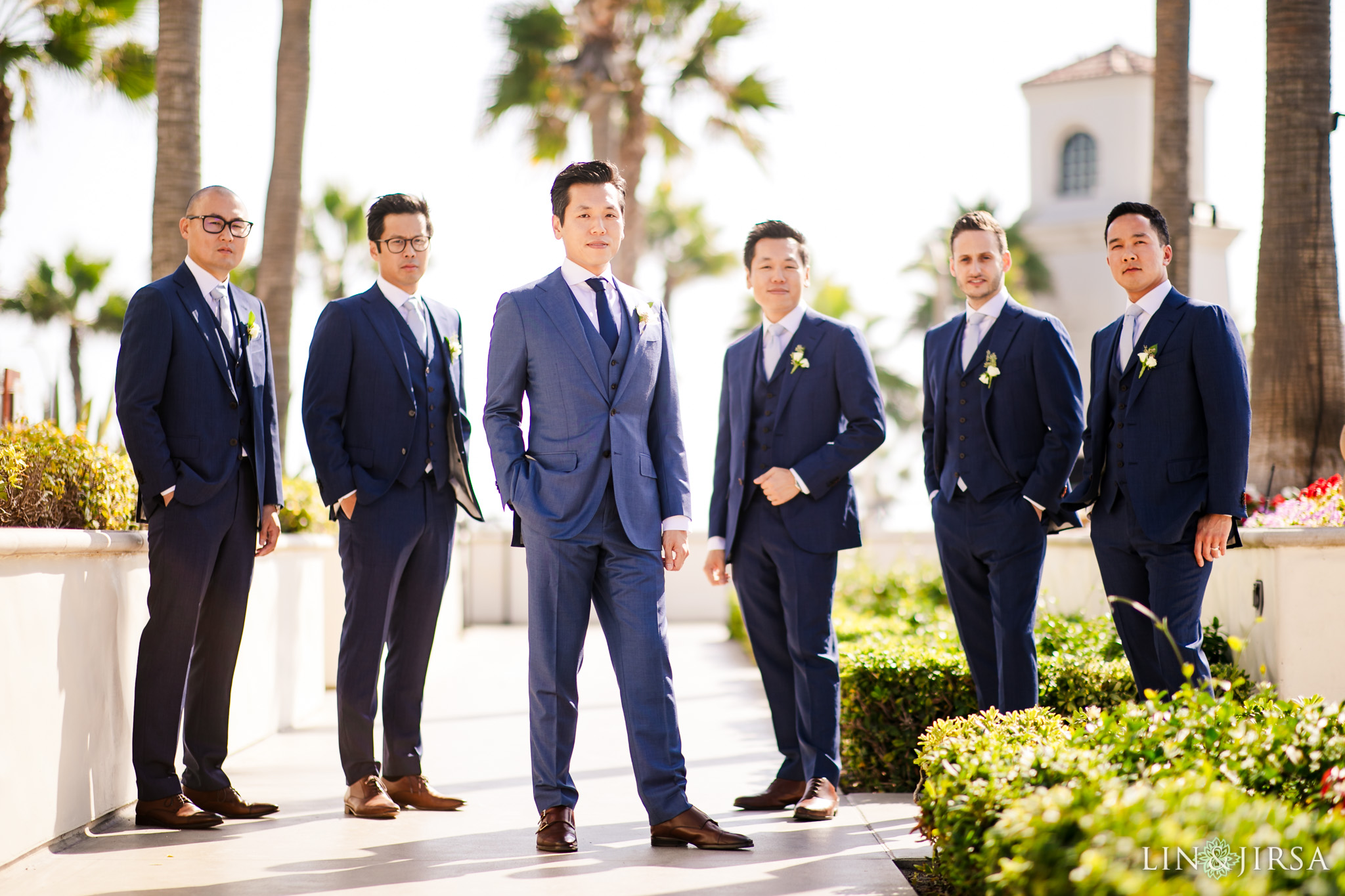 Wedding party on the lawn at the Hyatt Regency Huntington Beach photographed by Lin and Jirsa