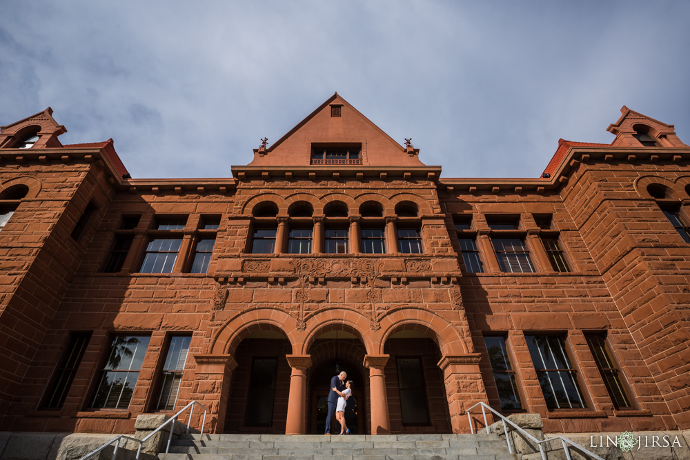 Wedding couple posing in hallway of historic Orange County Courthouse with period architecture