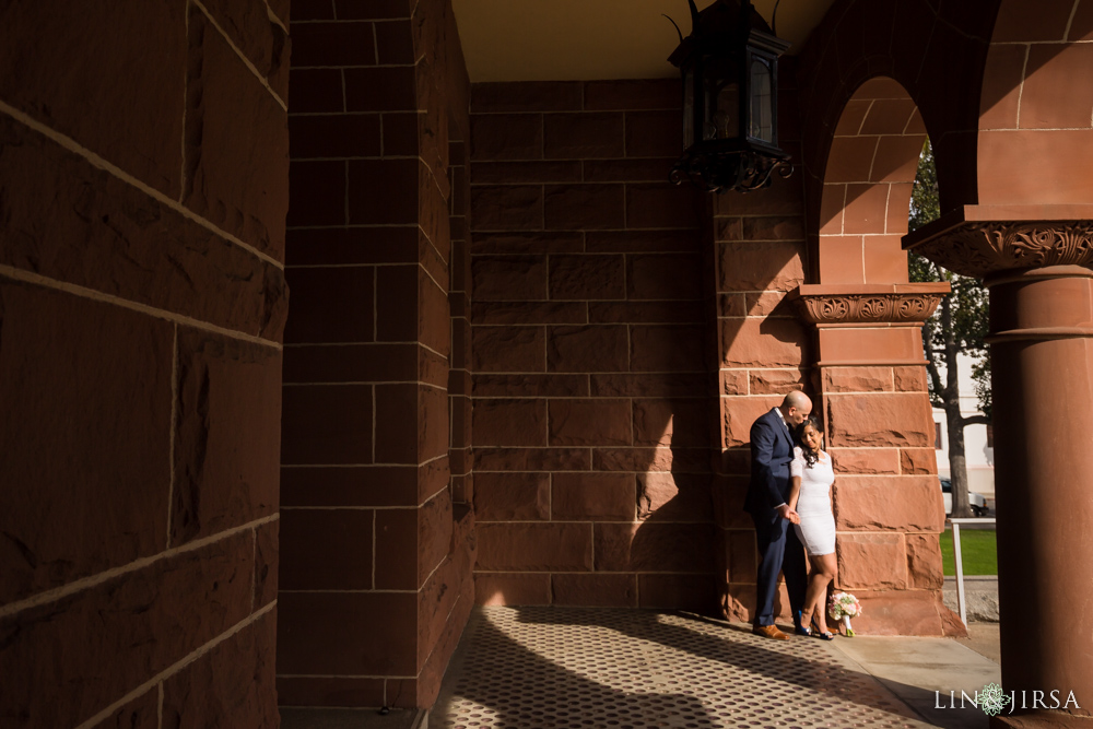 Romantic portrait of newlyweds at Old Courthouse Museum featuring vintage architectural details