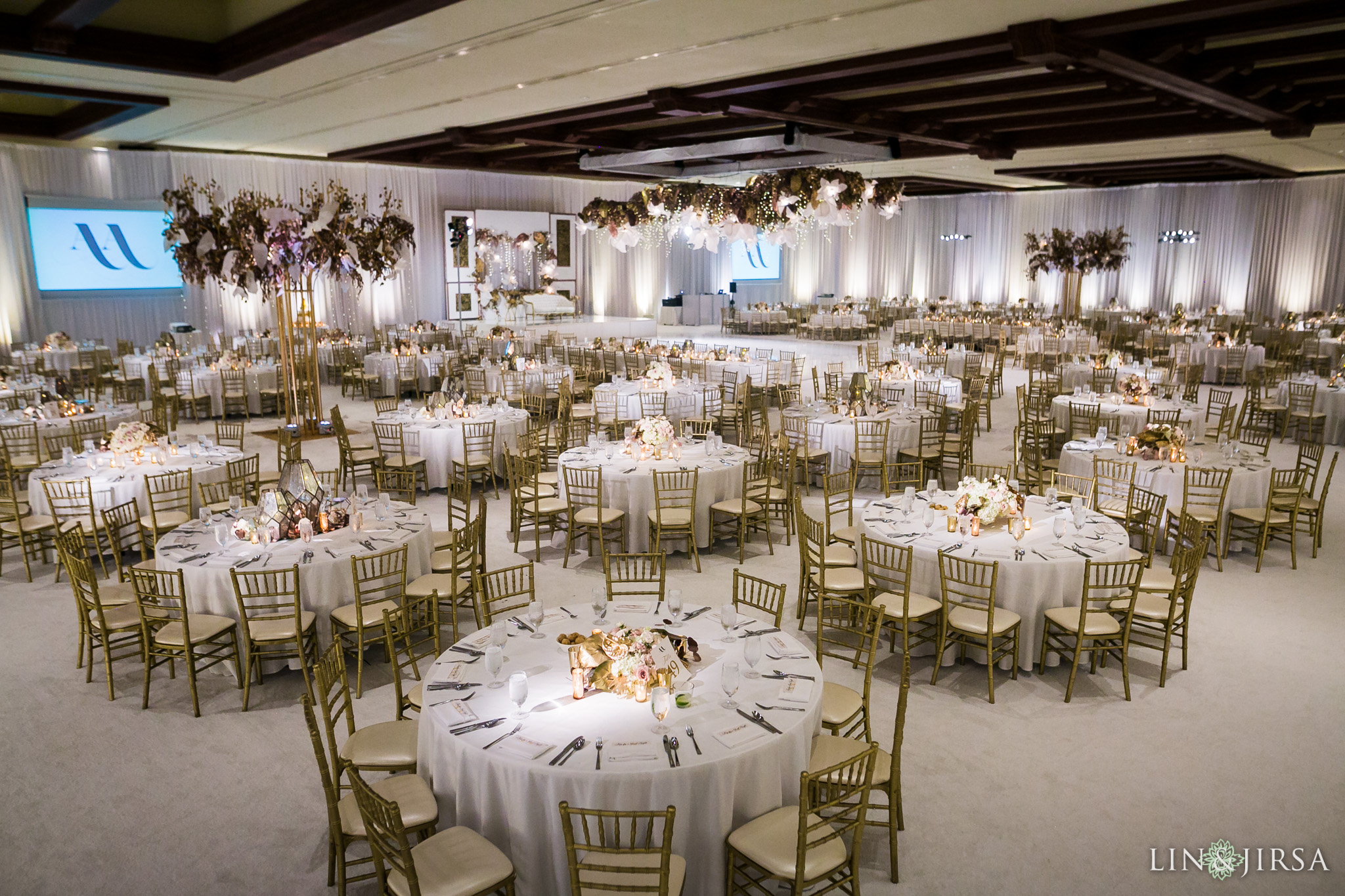 Wedding reception in the Grand Ballroom at the Hyatt Regency Huntington Beach photographed by Lin and Jirsa
