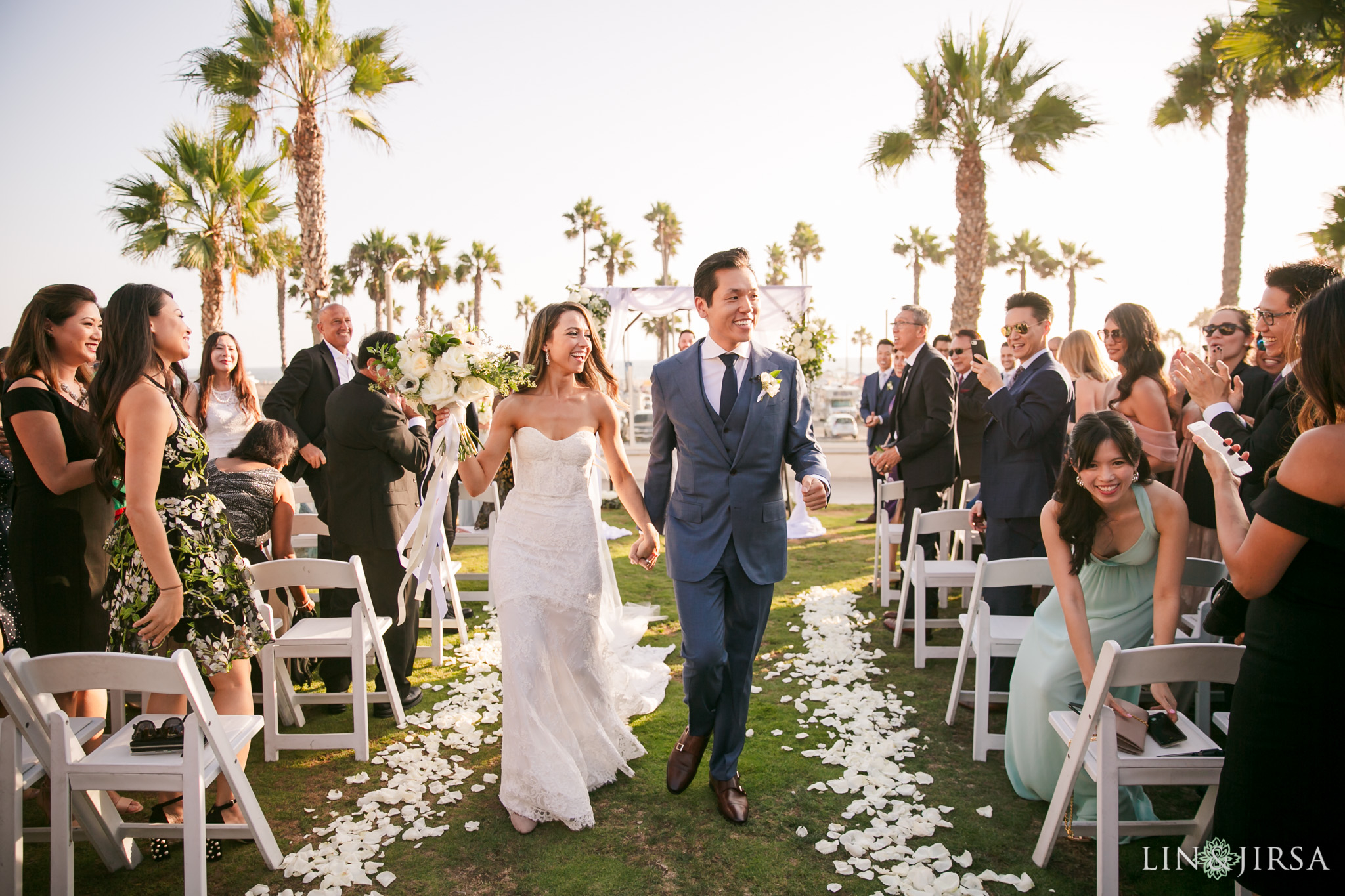 Ceremony by the reflection pool in the California Courtyard at a Hyatt Regency Huntington Beach wedding by Lin and Jirsa