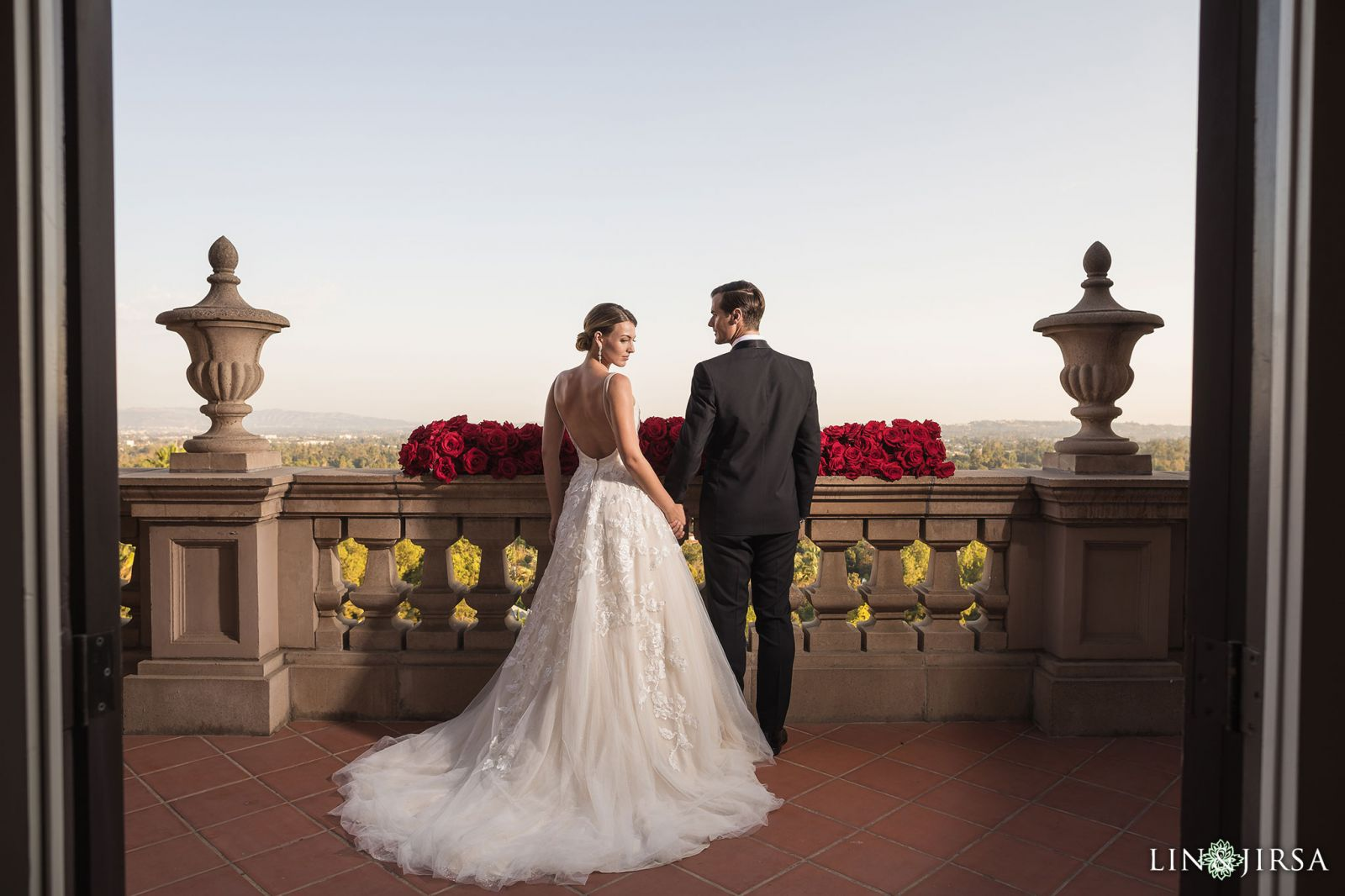 Couple portrait on the balcony at Langham Huntington Pasadena with Pasadena skyline in background by Lin and Jirsa