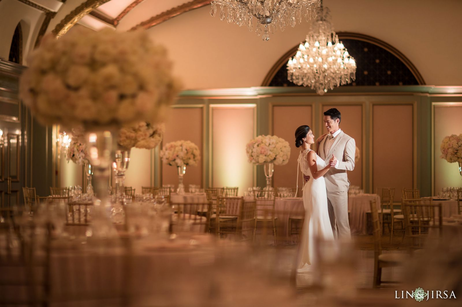 Wedding reception in the Huntington Ballroom at Langham Huntington Pasadena with crystal chandeliers by Lin and Jirsa
